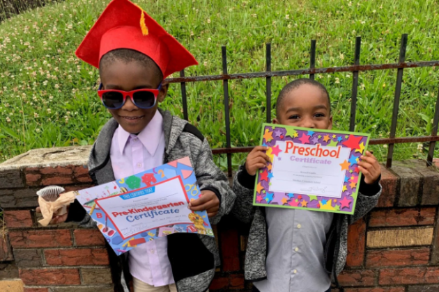 Photo of Kenneth and Emmanuel graduating preschool.