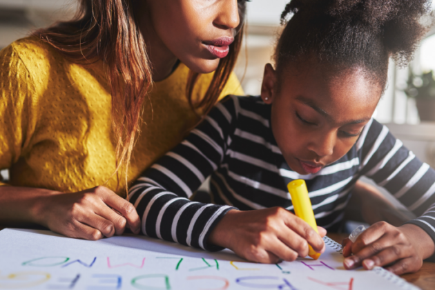 Mother and child learning the alphabet.